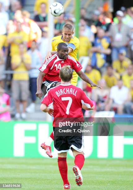 Olof Mellberg of Sweden gets higher than Stern John and Christopher Birchall of Trinidad & Tobago during the Group B match in Dortmund, Germany on...