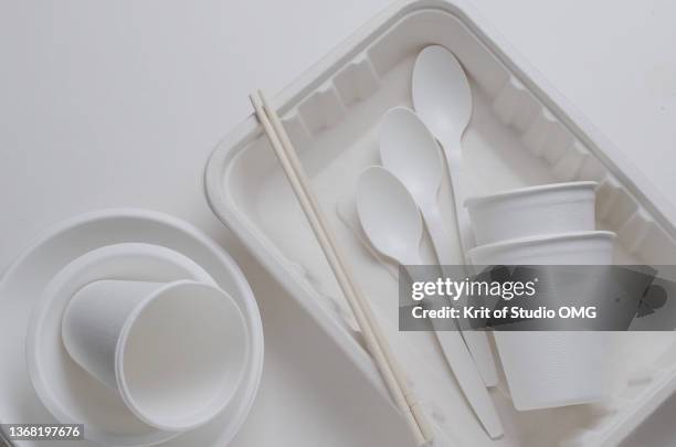 the biodegradable eating utensils on white floor - disposable silverware stock pictures, royalty-free photos & images