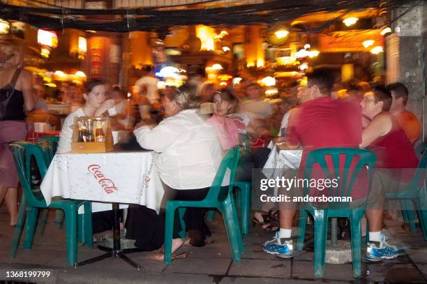 tourists are sitting at a restaurant in bangkok - khao san road stock pictures, royalty-free photos & images
