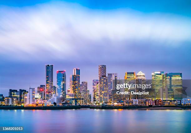 canary wharf business district skyline at twilight, london england - town center stock pictures, royalty-free photos & images