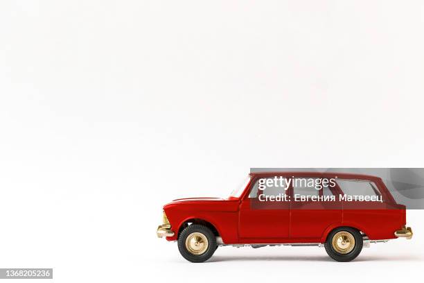 red metal retro toy car on white background. cars scale models collecting concept - toy cars photos et images de collection