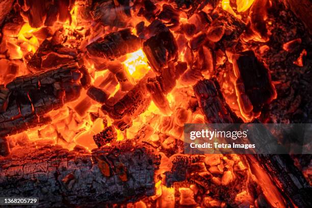 close-up of hot burning embers - burning embers stock pictures, royalty-free photos & images