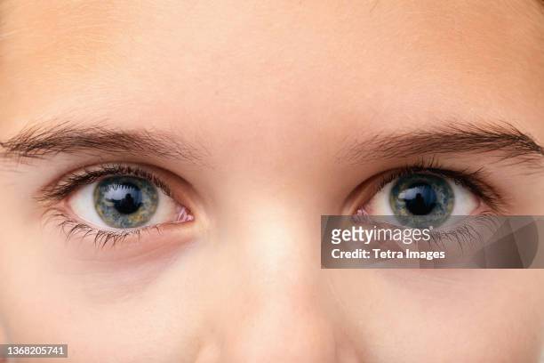 close-up of boys (10-11) eyes - boy 10 11 stock pictures, royalty-free photos & images