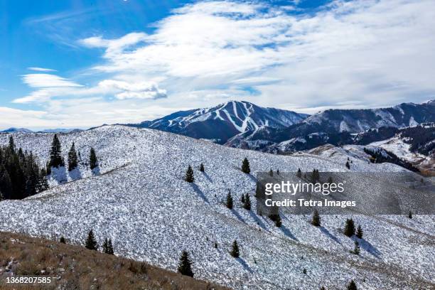 usa, idaho, ketchum, snow covered hillside with bald mountain in background - ketchum idaho stock pictures, royalty-free photos & images
