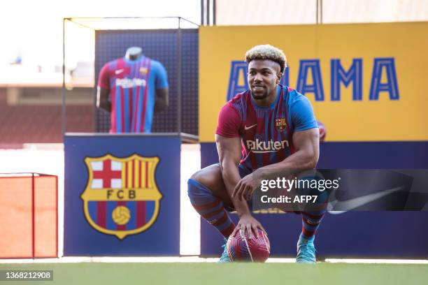 Adama Traore poses for photo during his presentation as new player of FC Barcelona at Camp Nou stadium on February 2 in Barcelona, Spain.