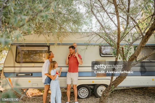 happy family during their rv vacation - family caravan stock pictures, royalty-free photos & images