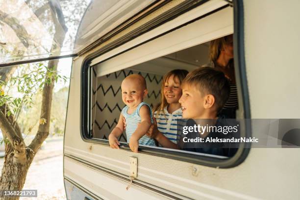 happiness in our camper van - caravan holiday family imagens e fotografias de stock