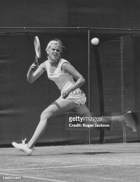 Sue Barker from Great Britain keeps her eyes on the tennis ball as she plays a running forehand return against Valerie Ziegenfuss from the United...