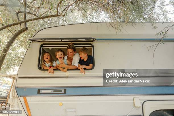 happiness in our camper van - caravan stockfoto's en -beelden