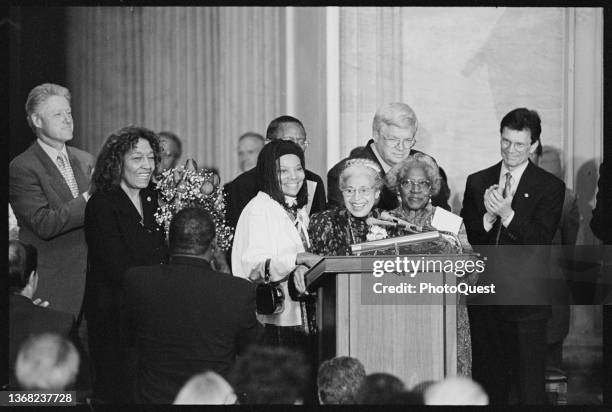 American Civil Rights activist Rosa Parks smiles as she speaks during a ceremony where she was presented with the Congressional Gold Medal,...