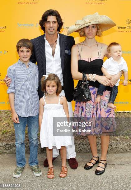 Polo player and model Nacho Figueras poses for a photo with his family; wife Delfina Blaquier and their children Hilario, Aurora and Artemio at the...