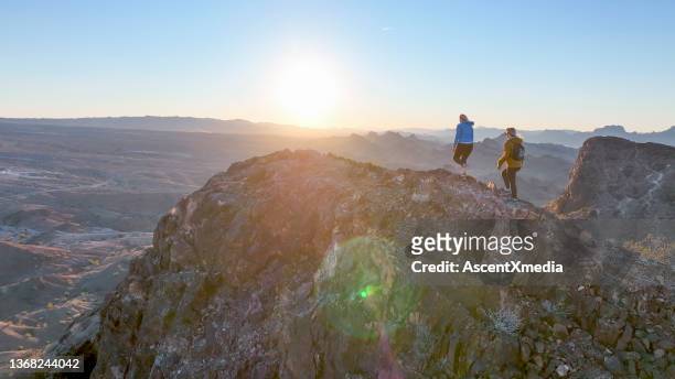 aerial view, female hikers follow route along desert ridge crest - arizona mountains stock pictures, royalty-free photos & images