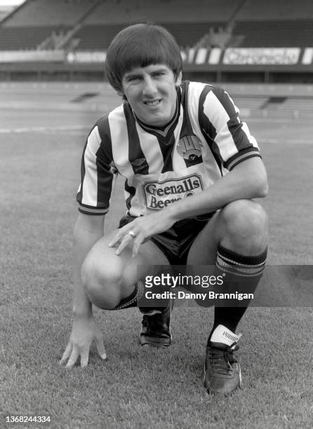 Newcastle forward Peter Beardsley pictured in his Greenalls sponsored Umbro Home kit at a photocall at St James' Park prior to the 1986/87 season in...
