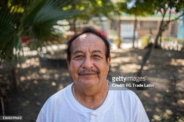 portrait of a latin senior man outdoors - mexican mustache stock pictures, royalty-free photos & images