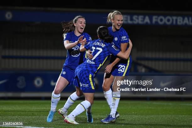 Jessie Fleming of Chelsea celebrates with teammates Niamh Charles and Pernille Harder after scoring her team's second goal during the FA Women's...