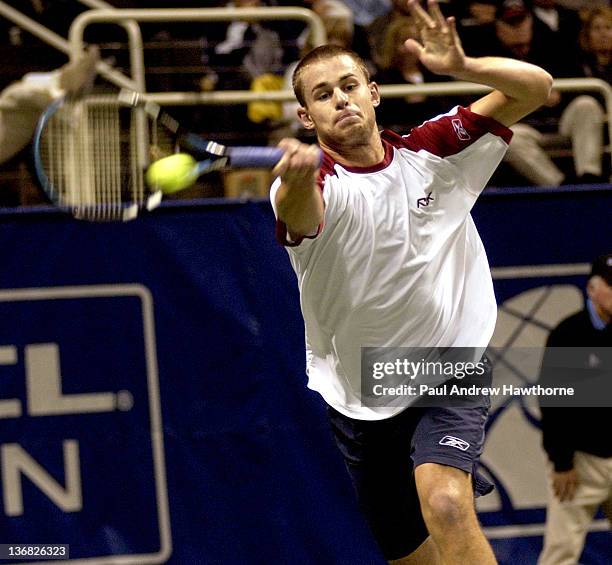 Andy Roddick hits a return shot during his match with Kristof Vliegen of Belgium at the 2004 Siebel Open in San Jose, California, February 12, 2004....