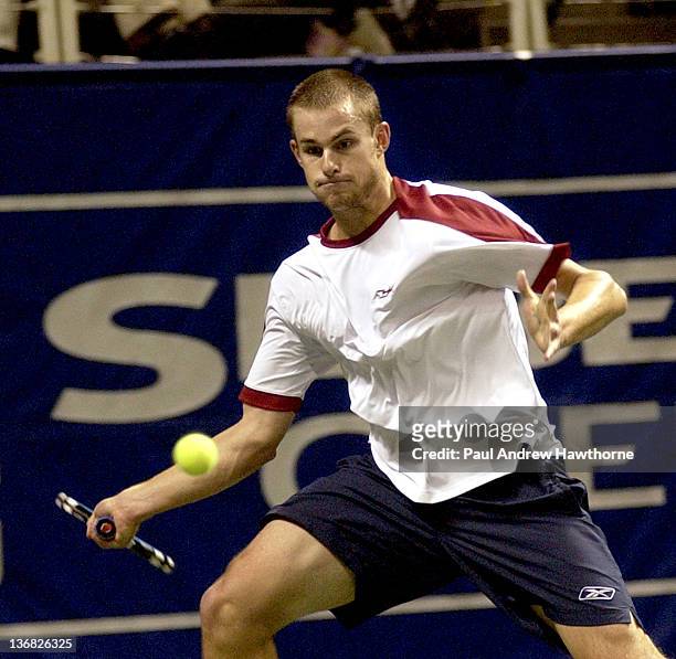 Andy Roddick hits a return shot during his match with Kristof Vliegen of Belgium at the 2004 Siebel Open in San Jose, California, February 12, 2004....