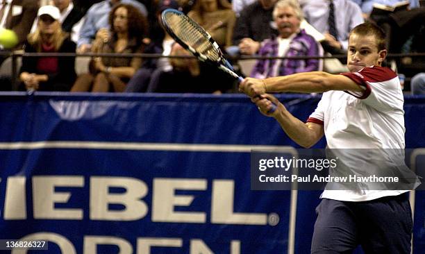 Andy Roddick hits a return shot during his match with Kristof Vliegen of Belgium at the 2004 Siebel Open in San Jose, California, February 12, 2004....