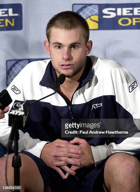 Andy Roddick speaks to the press after his match with Kristof Vliegen of Belgium at the 2004 Siebel Open in San Jose, California, February 12, 2004....