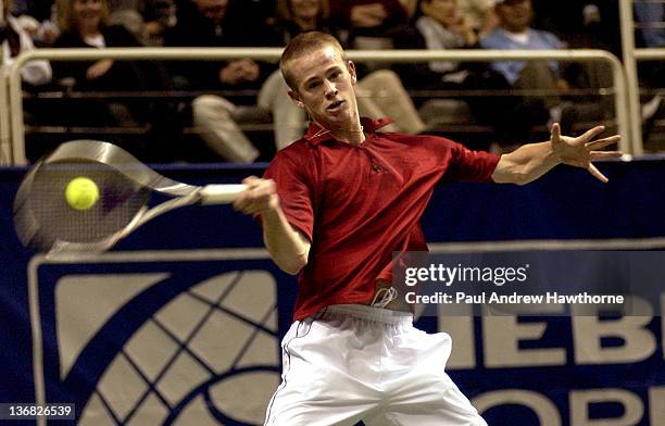 Kristof Vliegen of Belgium hits a return shot during his match with Andy Riddick at the 2004 Siebel Open in San Jose, California, February 12, 2004....