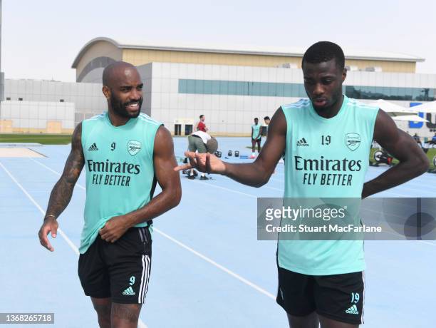 Alex Lacazette and Nicolas Pepe of Arsenal during a training session at Nad Al Sheba Training Centre on February 02, 2022 in Dubai, .