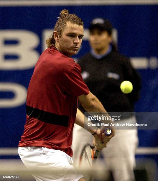 Mardy Fish hits a return shot during his match with Andre Agassi at the 2004 Siebel Open in San Jose, California, February 14, 2004. Fish upset...