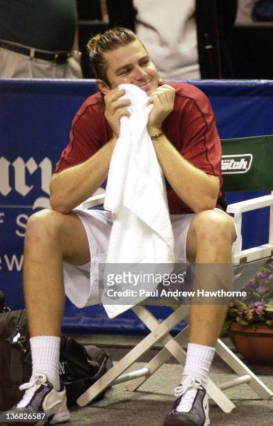 Mardy Fish laughs at humorous comments by Andy Roddick during Roddick's interview after their finals match at the 2004 Siebel Open in San Jose,...