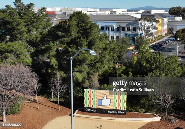 In an aerial view, a sign is posted in front of Meta headquarters on February 02, 2022 in Menlo Park, California. Facebook parent company Meta will...