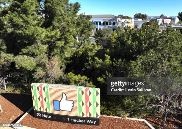 In an aerial view, a sign is posted in front of Meta headquarters on February 02, 2022 in Menlo Park, California. Facebook parent company Meta will...