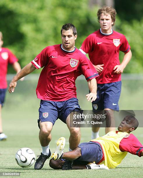 DeMarcus Beasley slides the ball away from Carlos Bocanegra. In the final training session at the camp at SAS Park, in Cary, North Carolina on May 21...