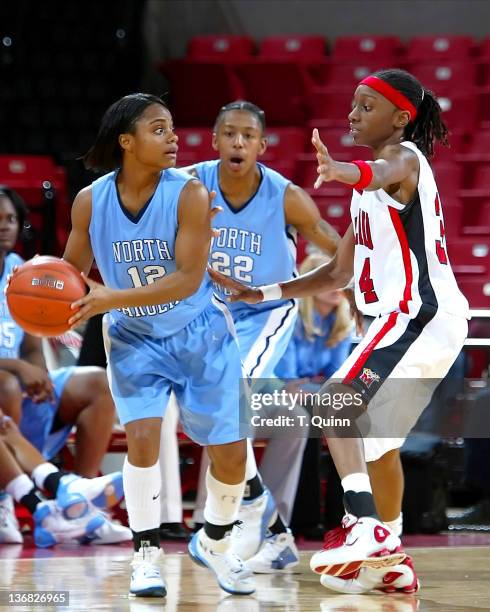 Ivory Latta looks for someone to pass to as Anesia Smith guards during a game at Comcast Center in College Park, MAryland on January 9, 2005.