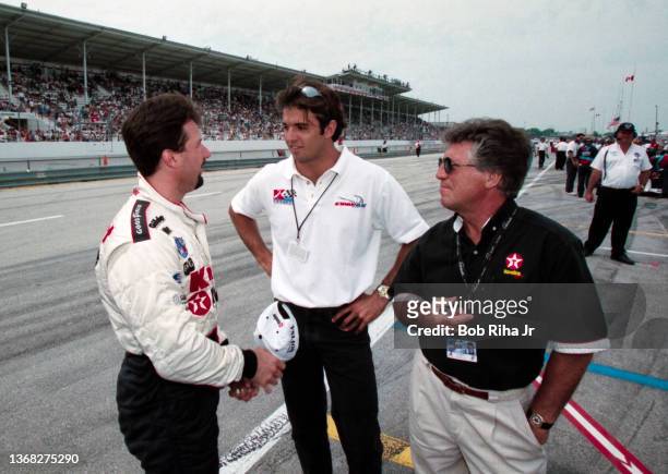 Michael Andretti and his father Mario Andretti before CART race at California Speedway, September 26, 1997 in Pomona, California.