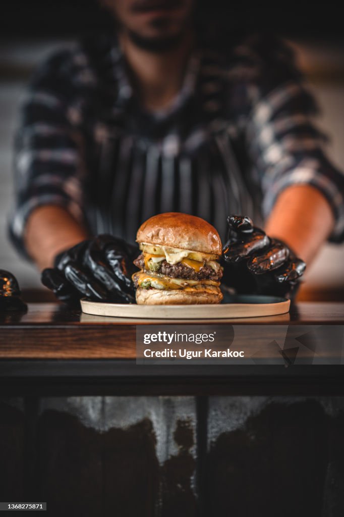 Chef preparing hamburger