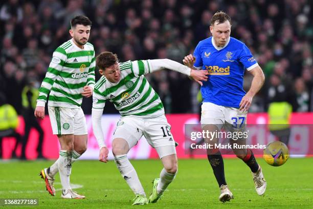 James McCarthy of Celtic battles for the ball with Scott Arfield of Rangers during the Cinch Scottish Premiership match between Celtic FC and Rangers...