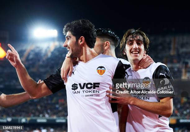Goncalo Guedes of Valencia CF celebrates with his teammate Bryan Gil of Valencia CF after scoring the opening goal during during the Copa del Rey...
