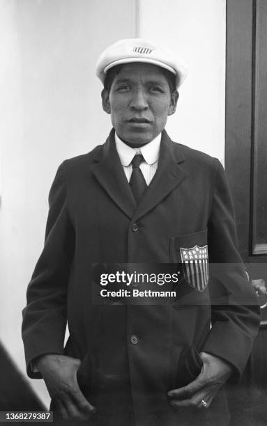 Tsökahovi Tewanima, part of the Hopi tribe and the winner of the 10,000 meter race at the 1912 Olympics. He is wearing the uniform given to him by...
