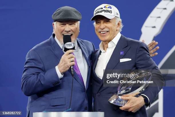 Los Angeles Rams owner Stan Kroenke speaks to Terry Bradshaw while holding the George Halas Trophy after defeating the San Francisco 49ers in the NFC...