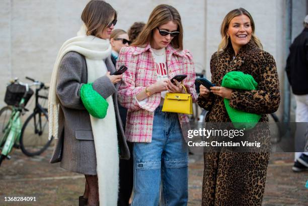 Darja Barannik wearing scarf, grey blazer, Bottega Veneta bag in green & Janka Polliani wearing coat with leopard print & Annabel Rosendahl wearing...