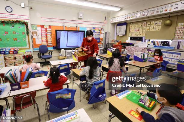 Principal Alice Hom hands out red envelopes and candy in a cultural celebration of the Lunar New Year at Yung Wing School P.S. 124 on February 02,...