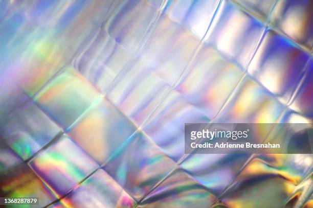 illuminated glass with iridescent tones - iridescent stockfoto's en -beelden
