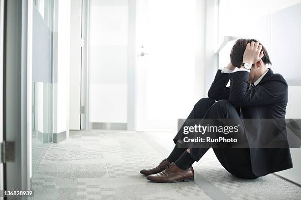 businessman in the office - sitting on floor stock pictures, royalty-free photos & images