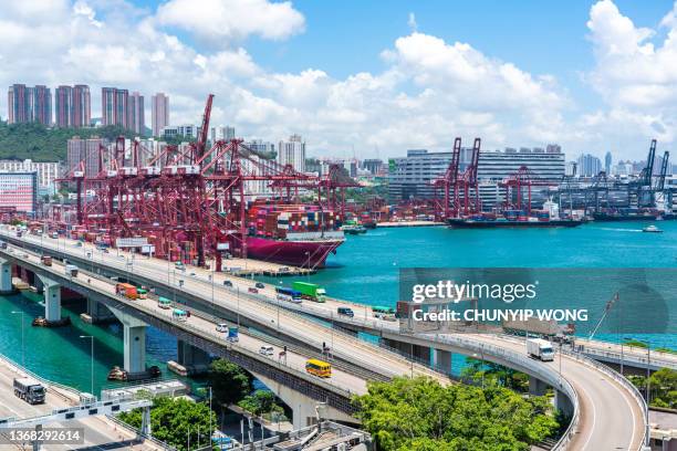 cargo terminal traffic in city at night - kwai tsing stock pictures, royalty-free photos & images