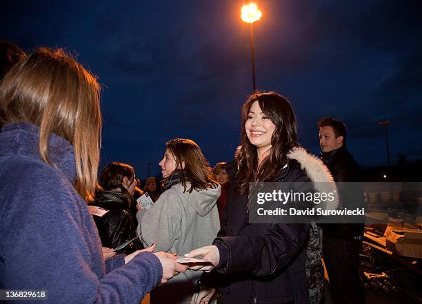 Actress Miranda Cosgrove meets children of military personnel at Naval Submarine Base New London on January 11, 2012 in Groton, Connecticut. Cosgrove...