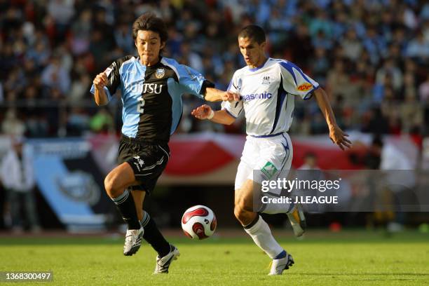 Hiroki Ito of Kawasaki Frontale and Magno Alves of Gamba Osaka compete for the ball during the J.League Yamazaki Nabisco Cup final between Kawasaki...