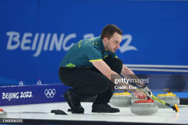 Dean Hewitt of Team Australia competes against Team China during the Curling Mixed Doubles Round Robin ahead of the Beijing 2022 Winter Olympics at...