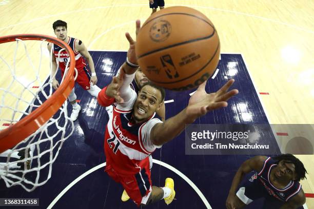 Daniel Gafford of the Washington Wizards reaches for a rebound past Tobias Harris of the Philadelphia 76ers during the third quarter at Wells Fargo...
