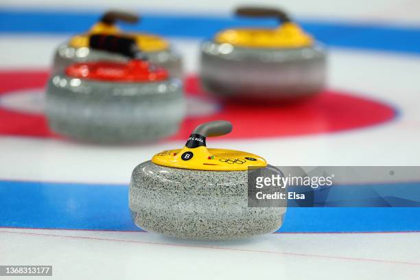 Curling stones sit in the house during the Curling Mixed Doubles Round Robin ahead of the Beijing 2022 Winter Olympics at National Aquatics Centre on...