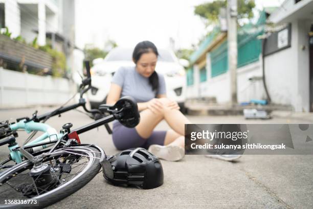 accident car crash with bicycle on road.young woman has an accident with  bicycle. - gory car accident photos stock pictures, royalty-free photos & images