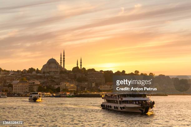 view of evening istanbul at sunset from the galata bridge - golden horn fotografías e imágenes de stock