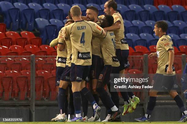 Newcastle Jets players celebrate an own goal by Macklin Freke of Brisbane Roar during the round 13 A-League men's match between Newcastle Jets and...